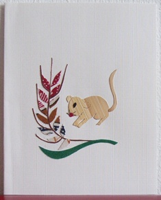 Muis met strohalm